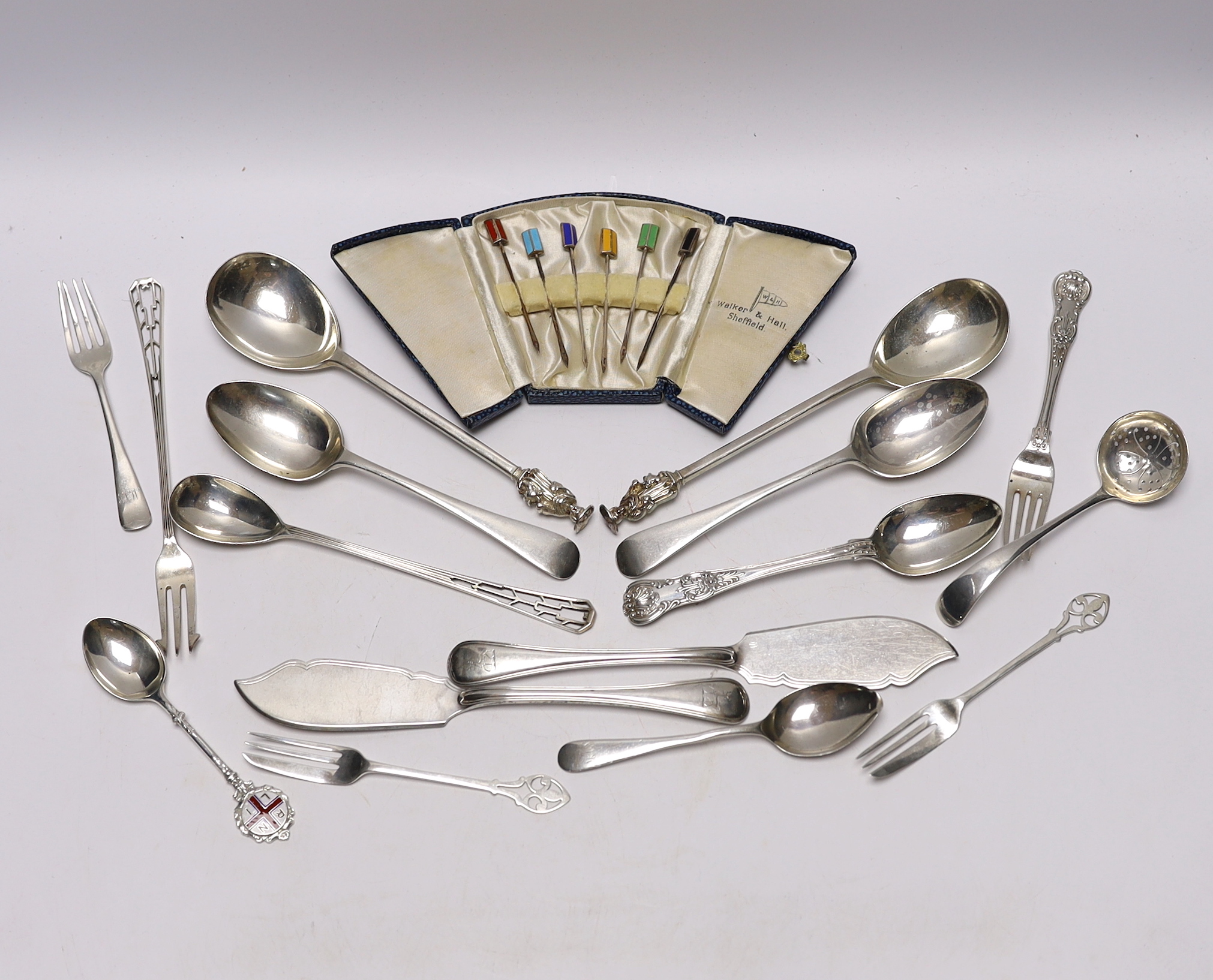 A pair of Edwardian silver apostles spoons, Josiah Williams & Co, London, 1902, 19.5cm and a small quantity of assorted silver flatware including pair of Victorian butter knives and a case of six silver and enamel cockta